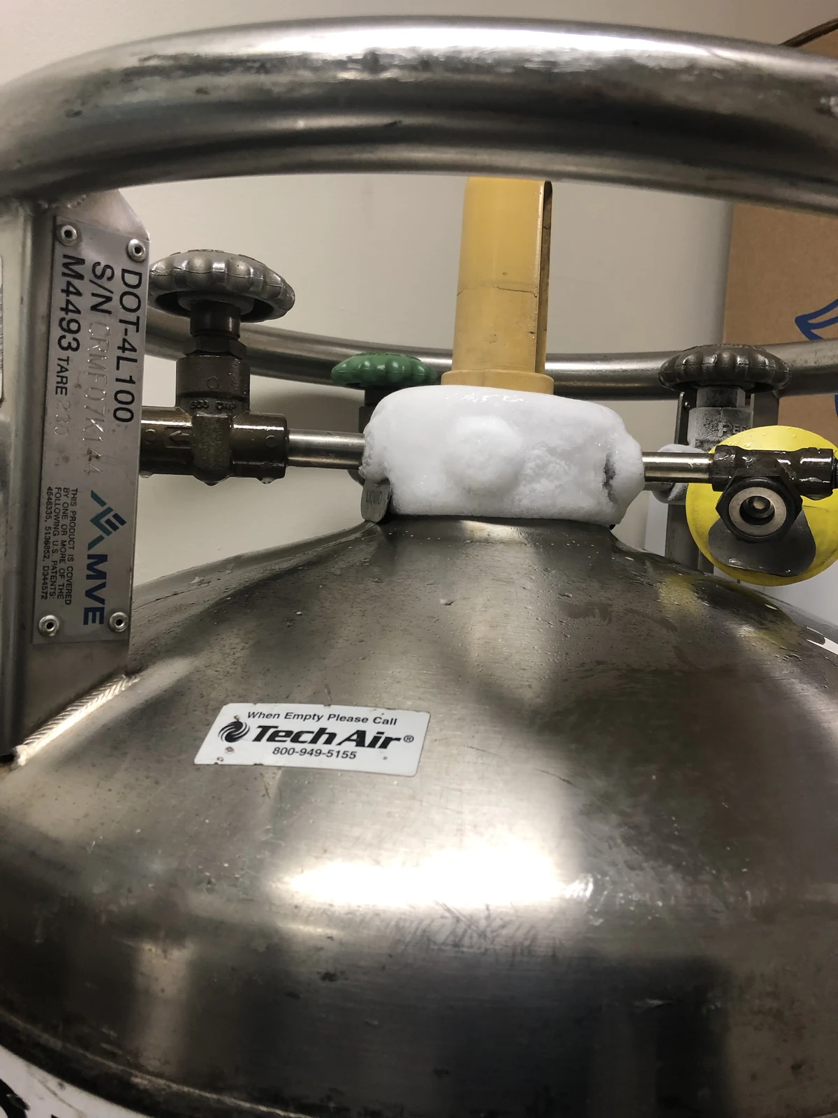 Frost-covered valve assembly on a cryogenic liquid cylinder