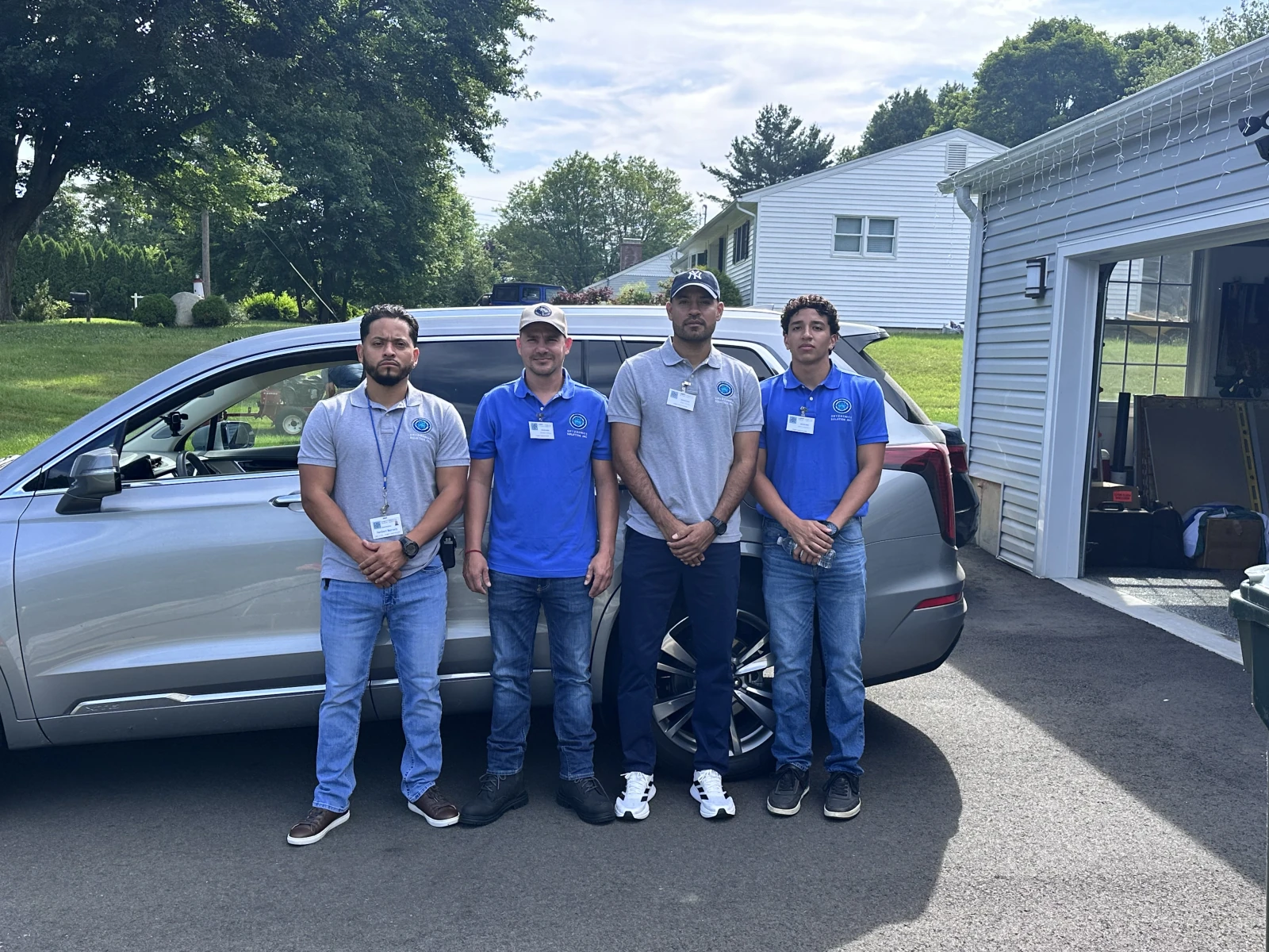 Four Cryogenics Solution technicians beside a service vehicle